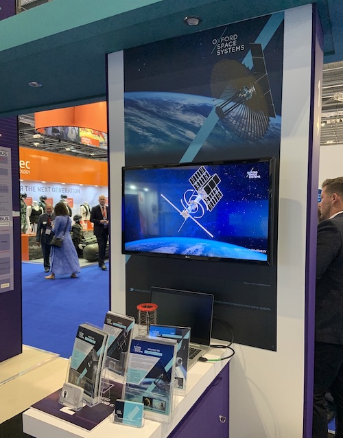 exhibition screen and monitor showing a space animation video